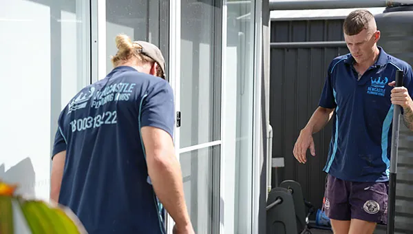 Two plumbers on site at a property